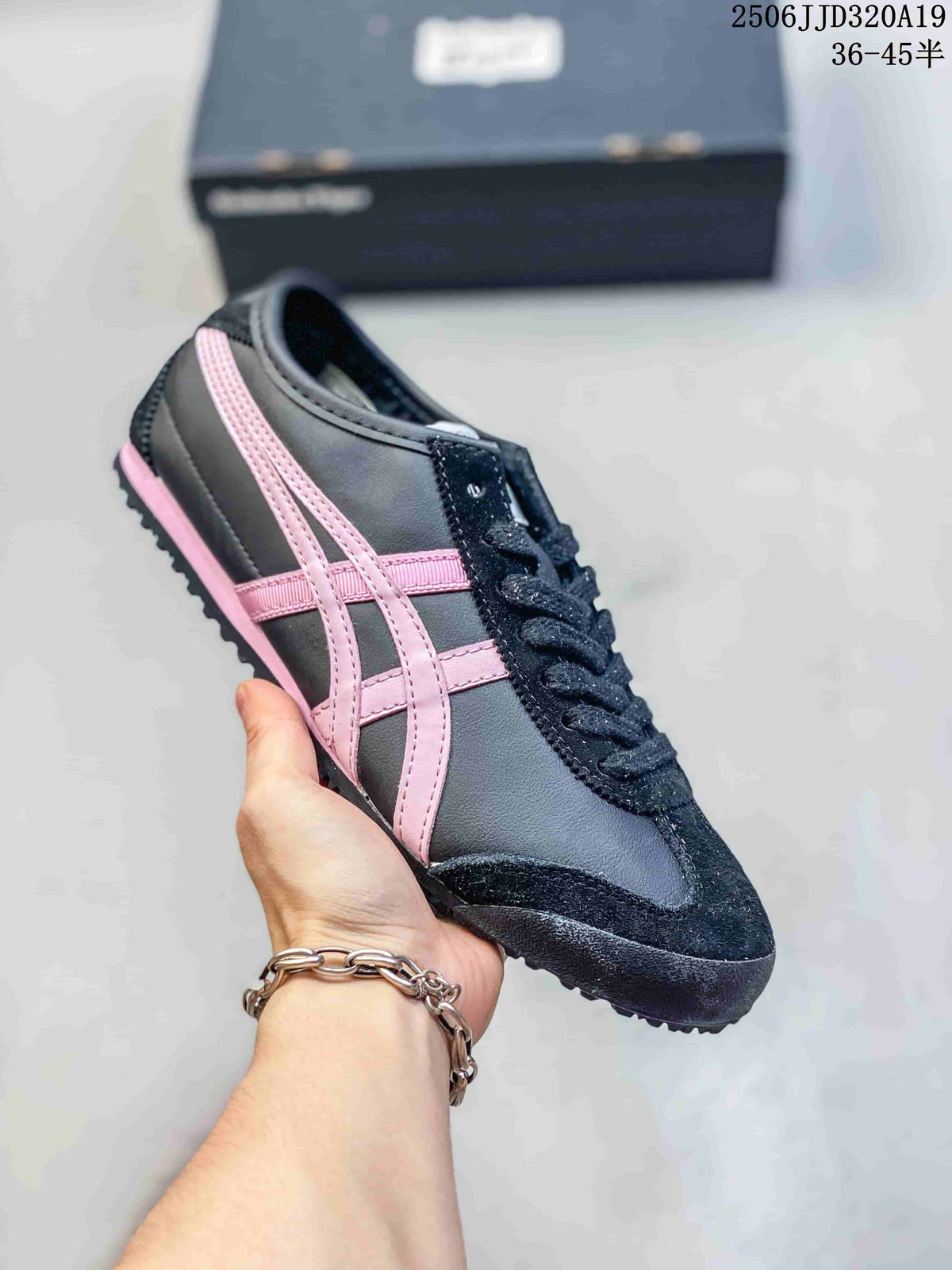 Dark gray low-top sneaker with pink side stripes and black laces