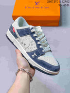Side view of a white and navy low-top sneaker with patterned side panels