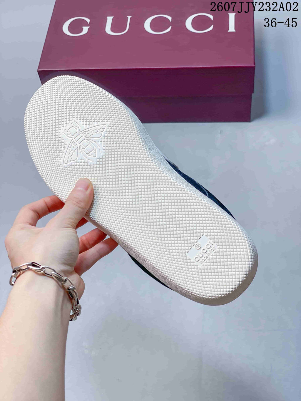 Textured white outsole of the navy and white sneakers