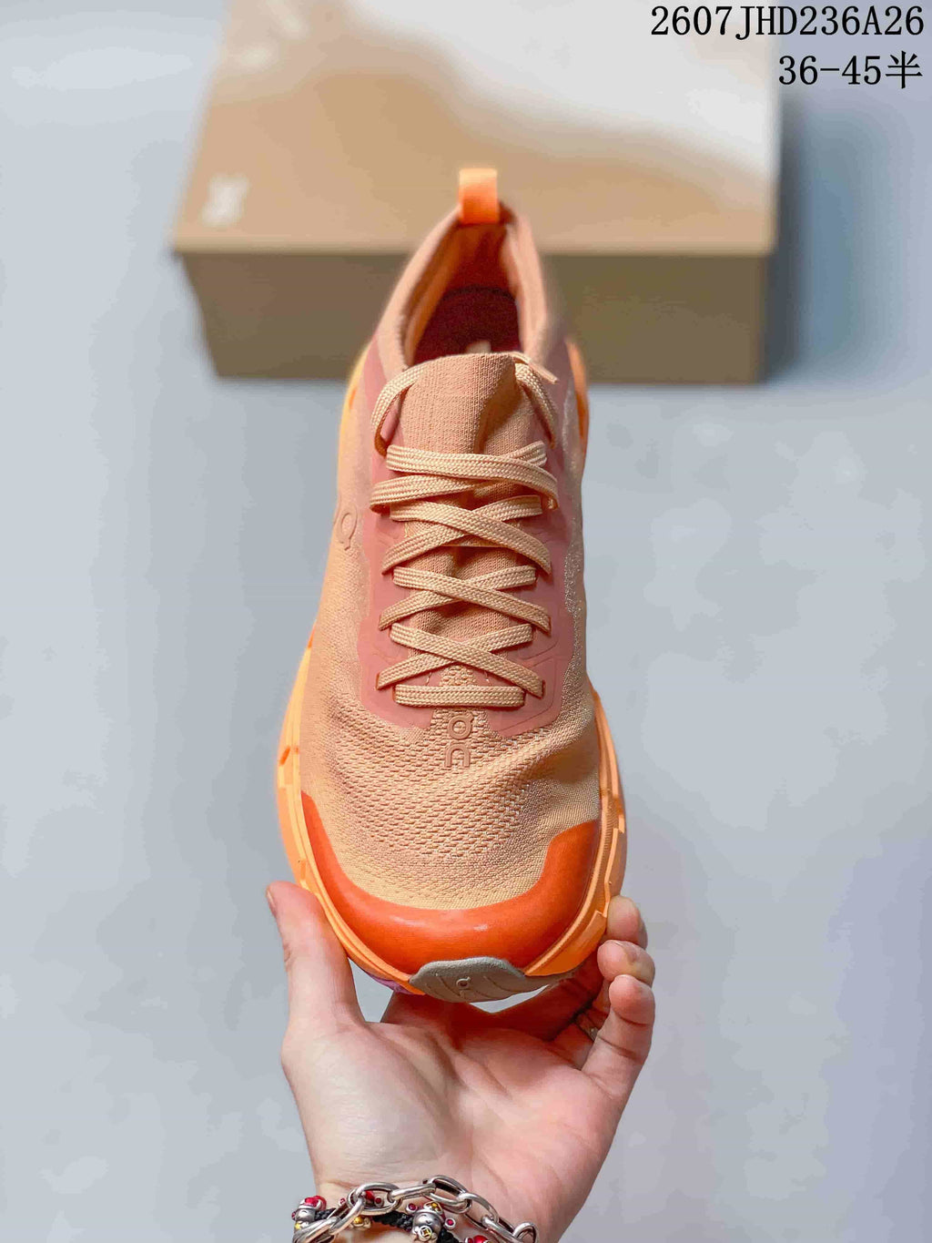 Top view showing the lace-up closure, textured toe box, and orange toe bumper.