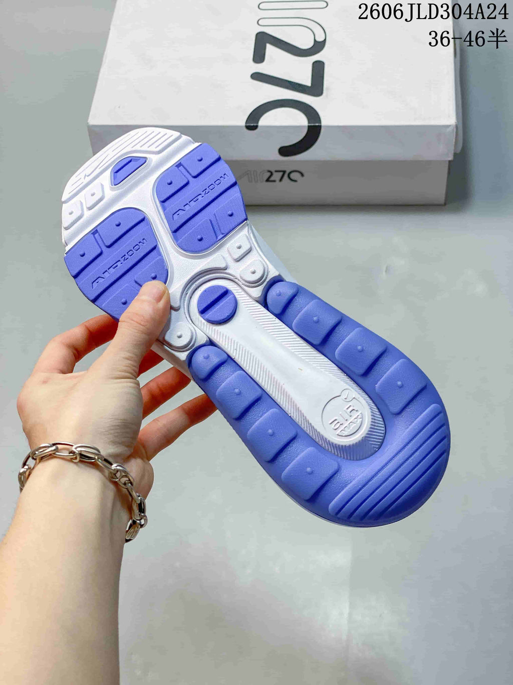 View of the blue-and-white patterned outsole of a Nike Air Max 270 sneaker.