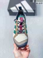Front view showing the lace-up construction, burgundy webbing and contrasting toe bumper.