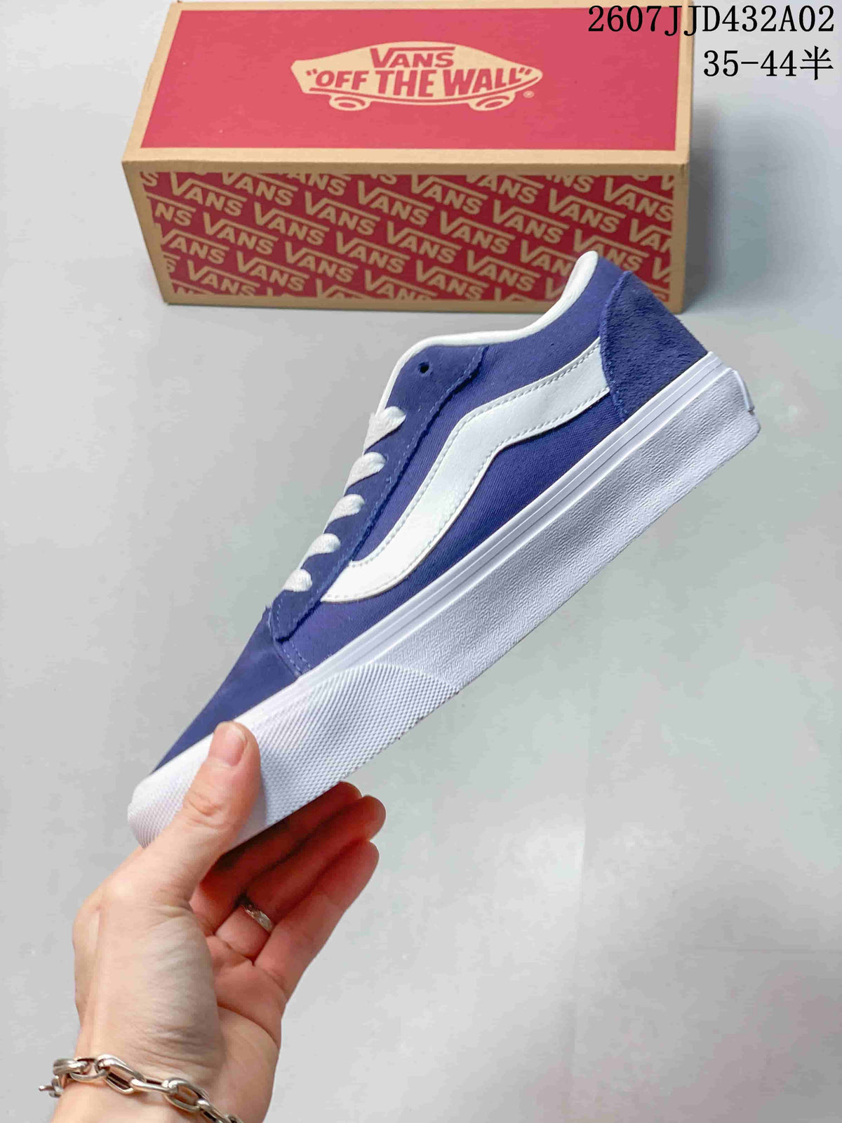 Side profile of the blue and white low-top sneaker