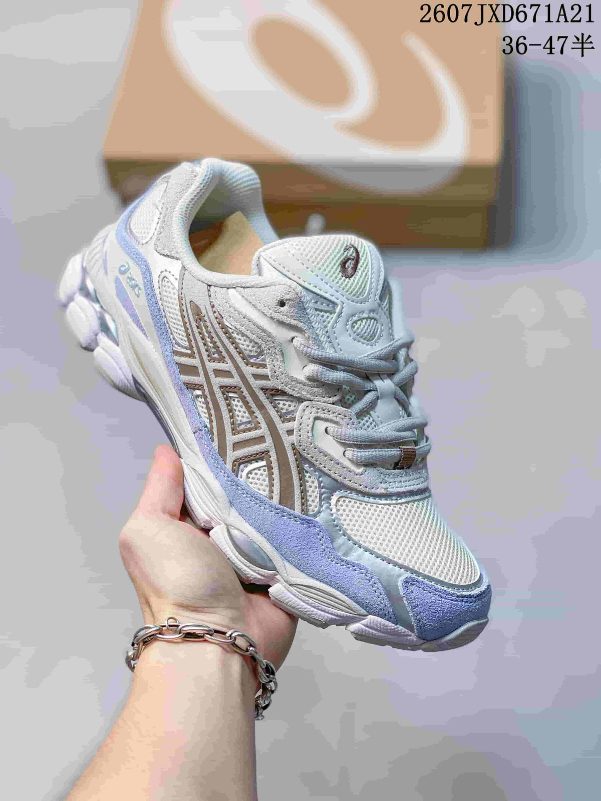 White and pale blue ASICS GEL-Kayano 14 sneaker with light-colored overlays.