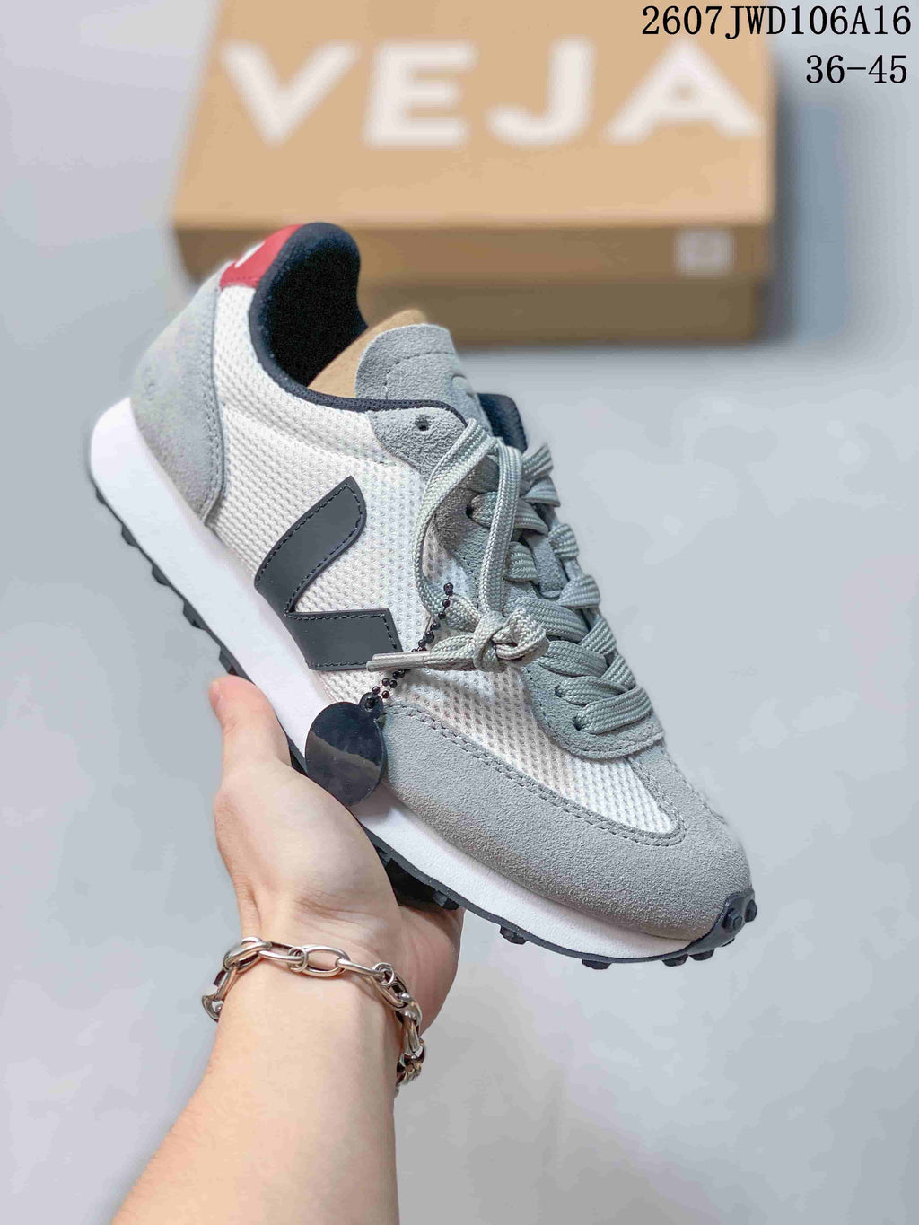 White and gray VEJA Rio Branco sneaker with dark V branding, gray laces and a white midsole.