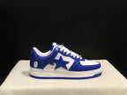 Close side profile showing the blue upper, white midsole, star-shaped side detail, and blue outsole.