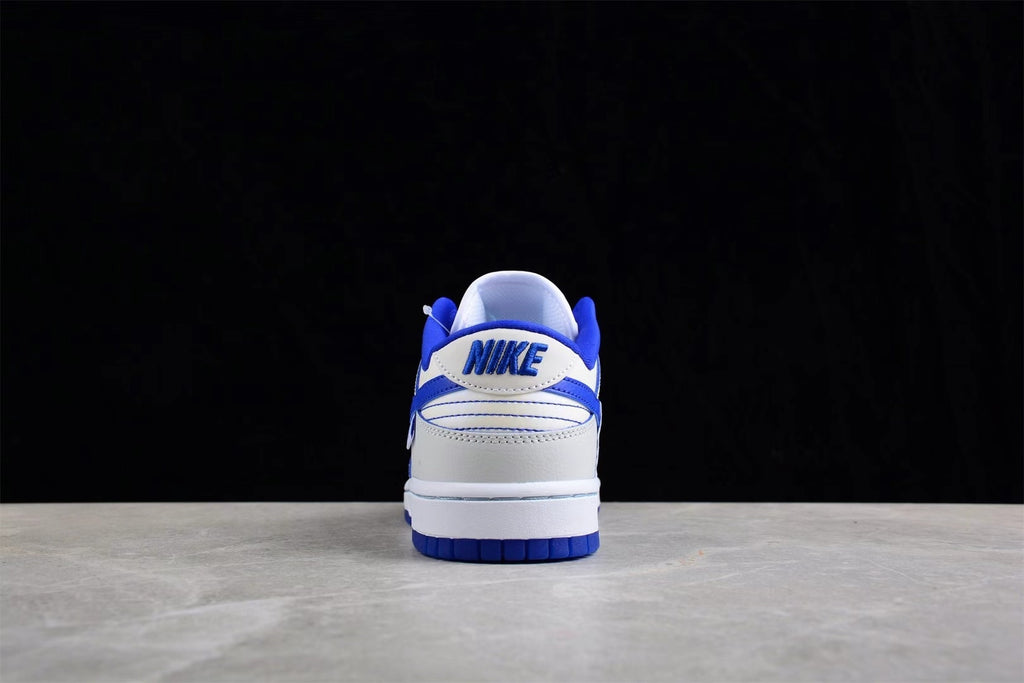 Rear view showing blue heel branding, white heel panels, and blue outsole sections.