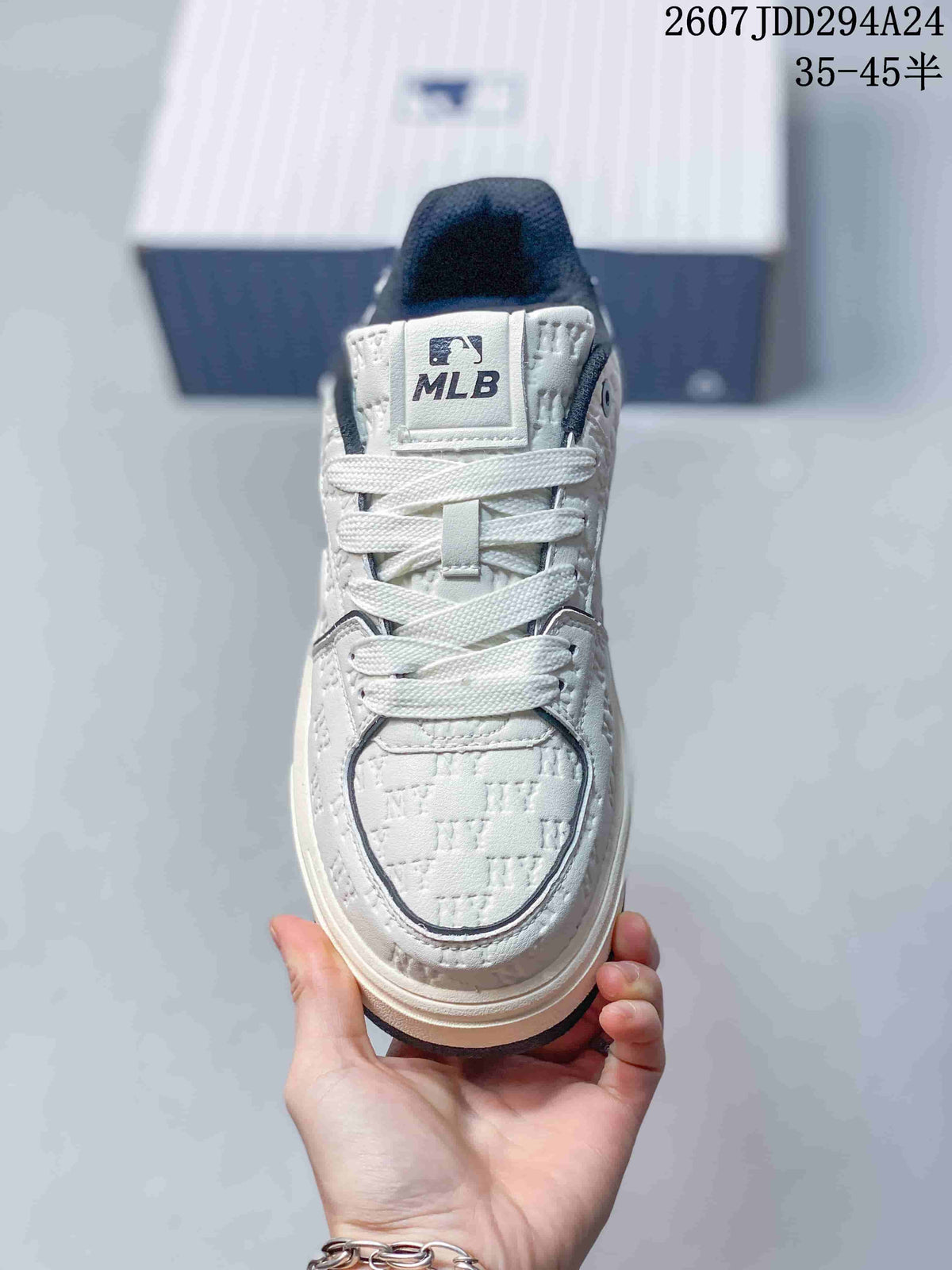 Front view of the lace-up sneaker showing the white tongue label with MLB branding and navy trim.