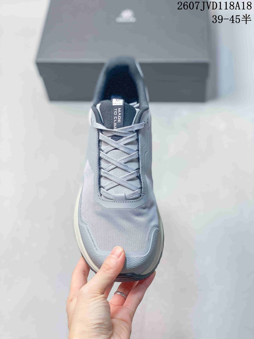 Top view of the sneaker showing the lace-up closure, padded collar, mesh-textured toe area, and protective toe overlay.