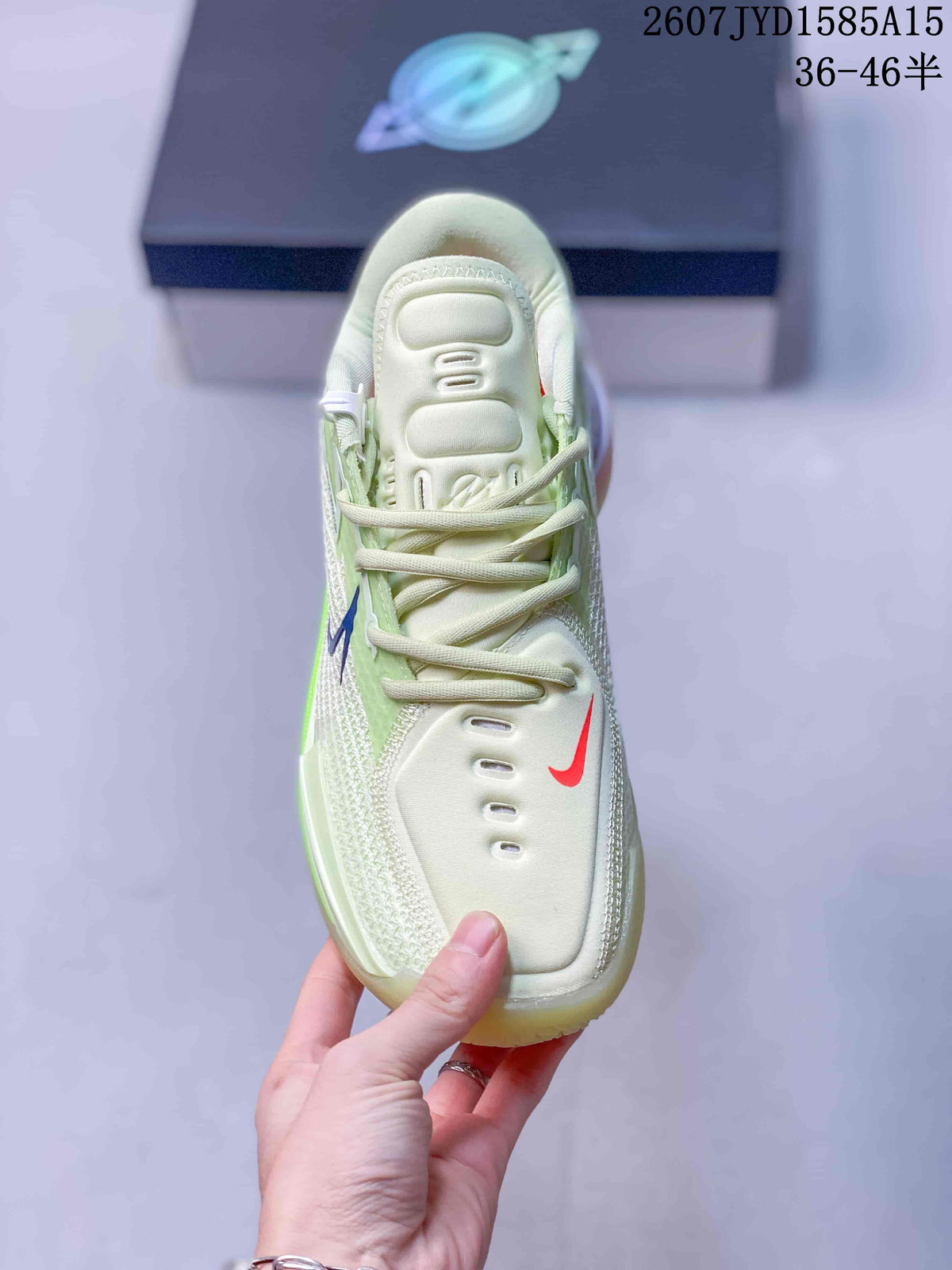 Top view of one shoe showing the padded tongue, cream laces, mesh side panels, and contrasting red and blue swoosh details.