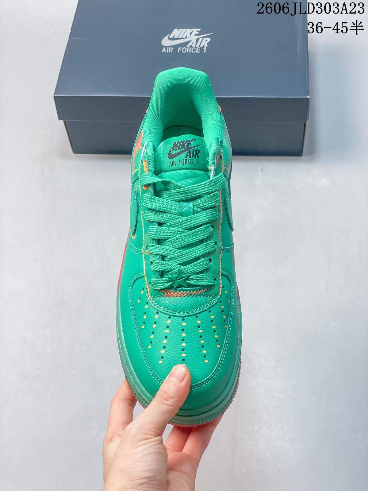 Top view showing the perforated toe, matching laces, and turquoise-green upper