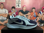 Side view highlighting the patterned panels and light blue-gray Swoosh