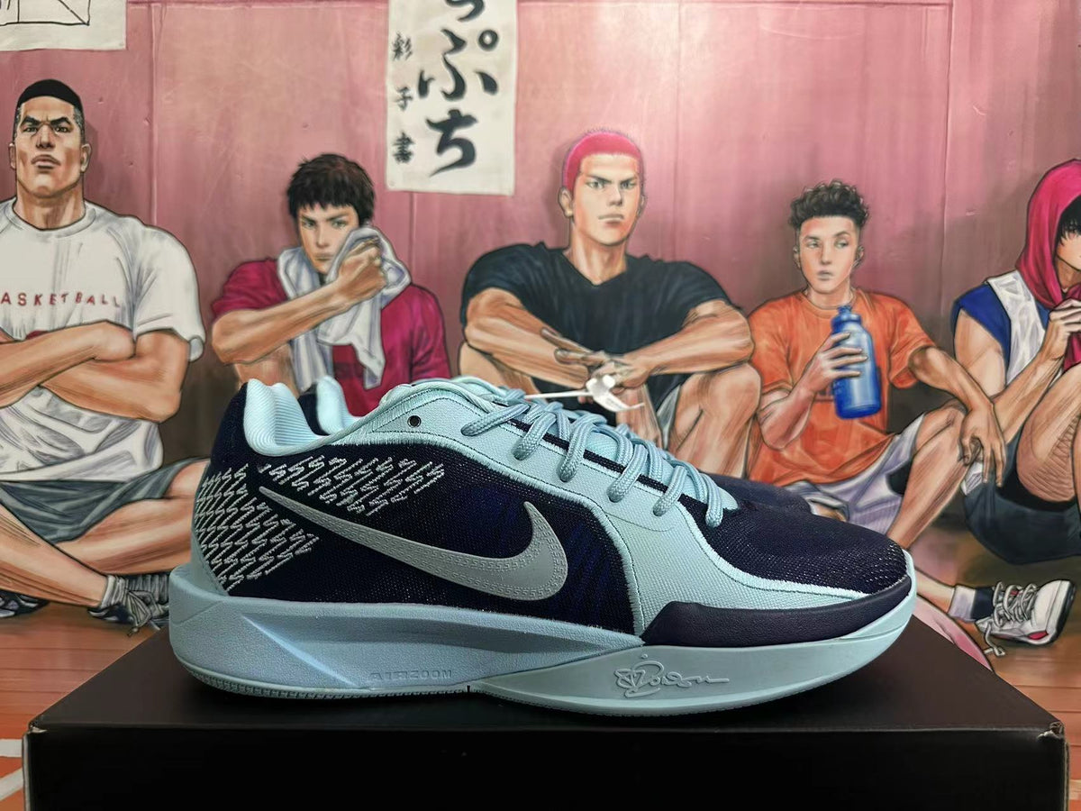 Side view highlighting the patterned panels and light blue-gray Swoosh
