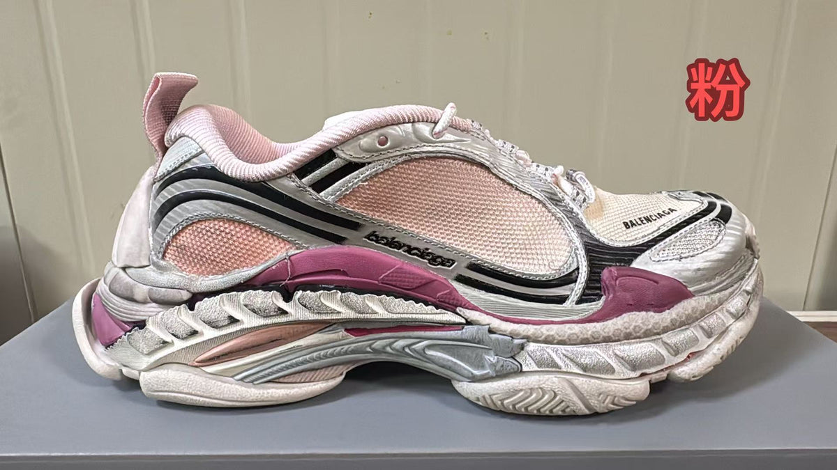Pink and white chunky Balenciaga sneaker with mesh panels, metallic overlays and a sculpted layered sole.