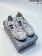 Pair of gray ECCO mesh sneakers shown on a branded shoe box