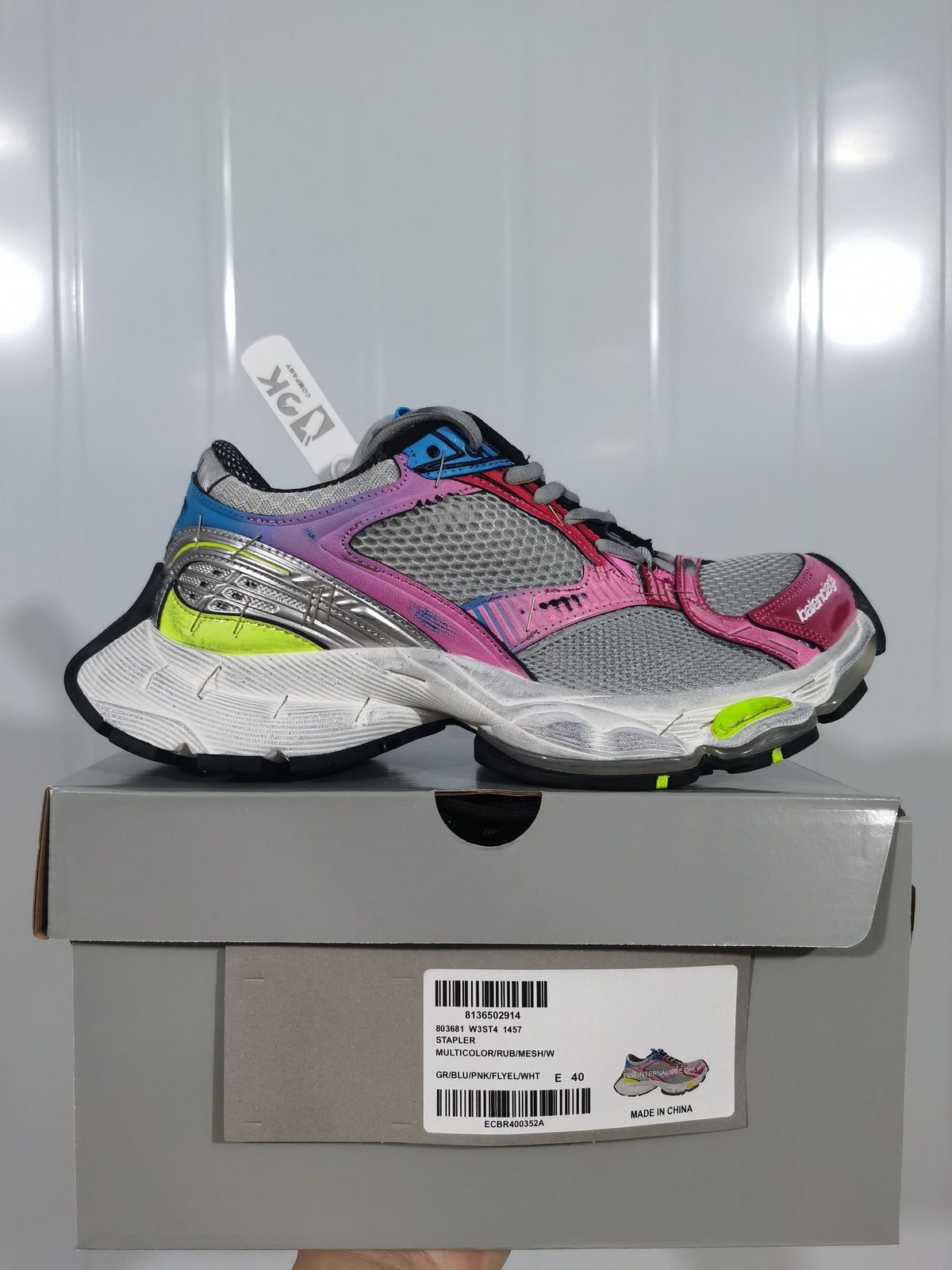 Multicolor Balenciaga 1457 sneakers displayed on a gray shoebox; the box label shows model code 1457, color text, and sample size 40.