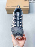 Top view showing the mesh toe box, layered lace-area overlays, tongue branding, and quick-lace style lacing.