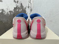 Rear view of blue and pink Nike Kobe basketball shoes showing pale heel panels and pink heel details