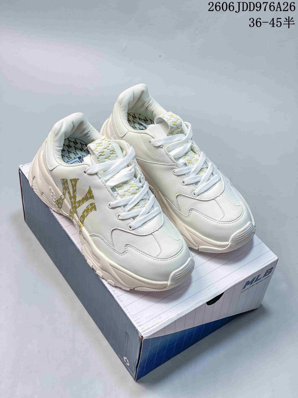 Pair of white and gold MLB chunky sneakers displayed on an MLB-branded shoebox.