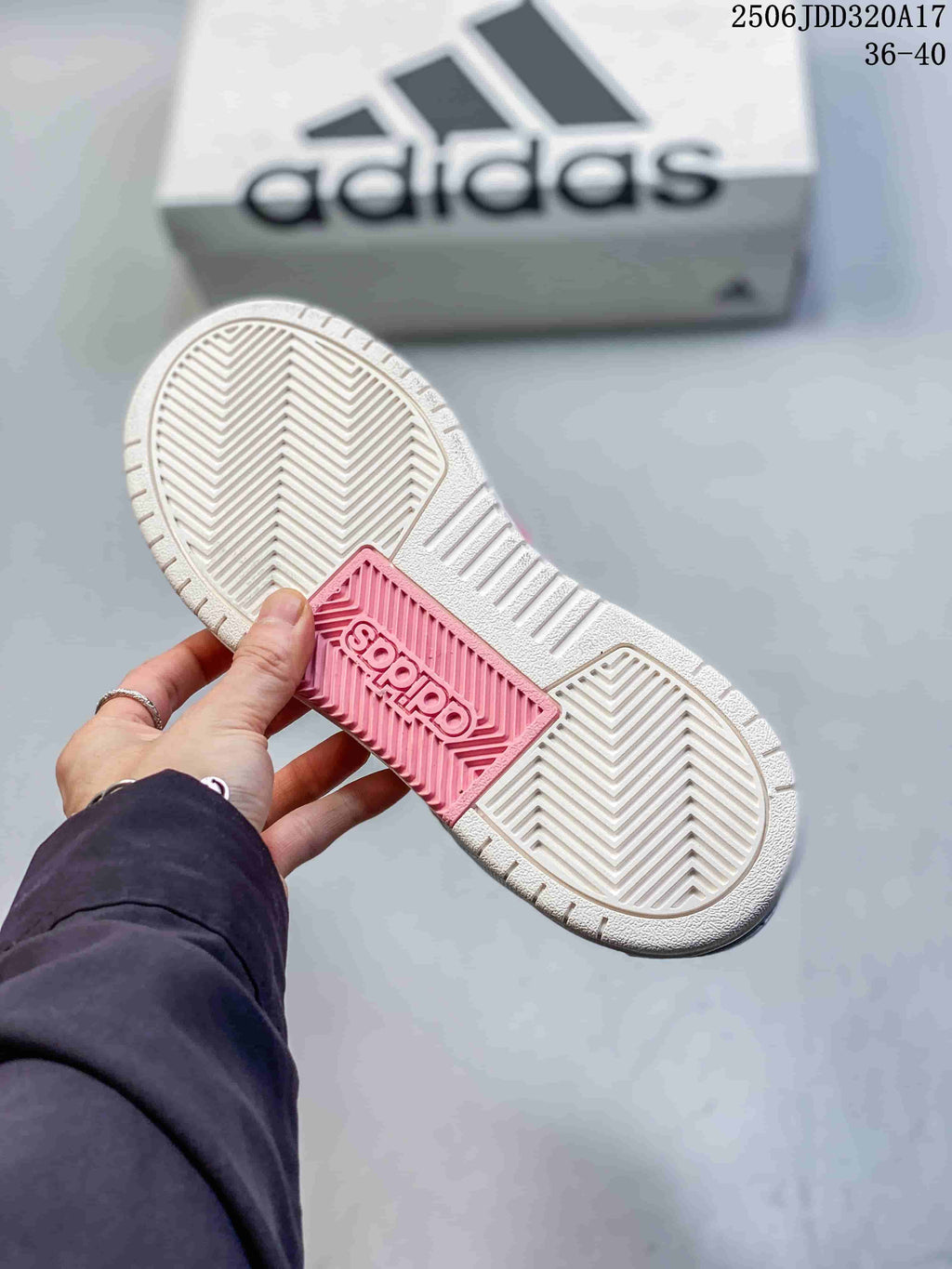 Close view of the adidas Entrap outsole with herringbone-style tread and a pink central section.