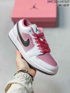 Angled side view showing the white and pink upper, black Swoosh, and low-top construction.
