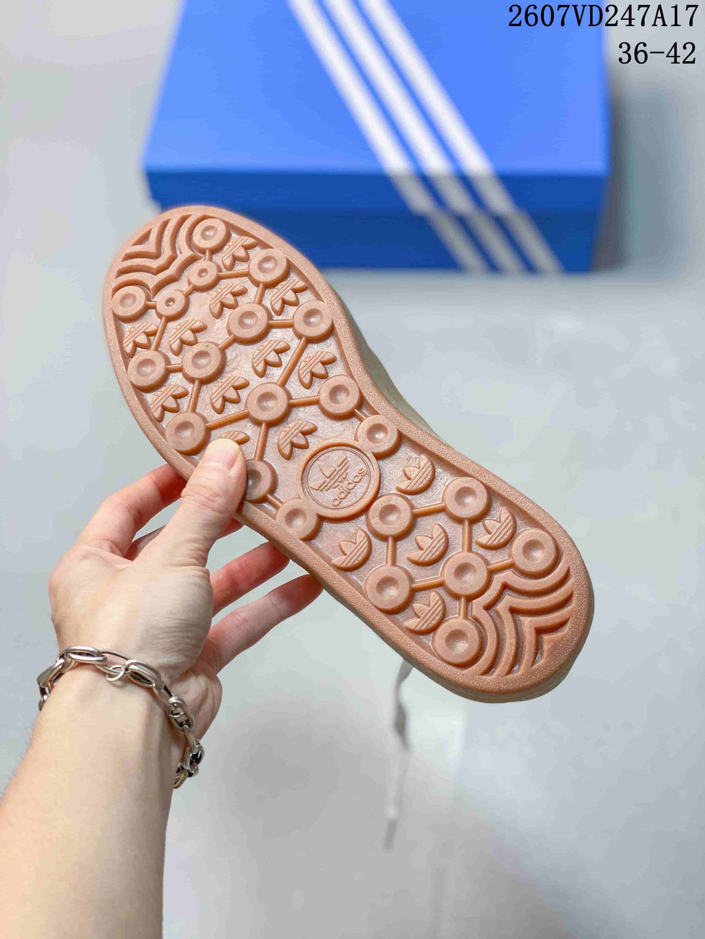 Close-up of the gum-colored outsole with a patterned adidas tread.
