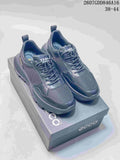 Black ECCO lace-up sneakers displayed on a branded shoe box, with mesh panels, contrasting overlays and a lugged outsole.
