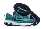 Teal and navy basketball shoe with mint-colored sole accents