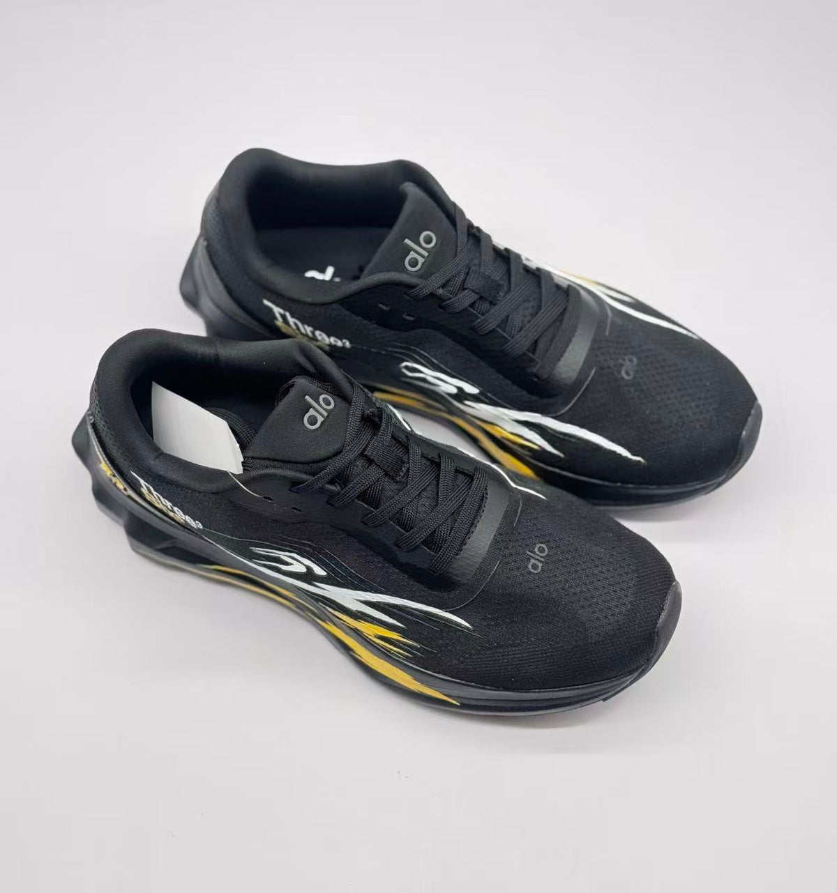 Top three-quarter view showing the lace-up construction, padded collars and branded tongues.