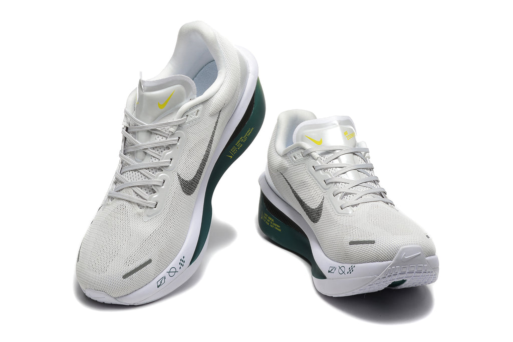 Off-white Nike Zoom Fly 6 shoes with dark green and yellow accents, viewed from the front