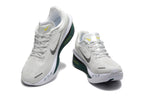 Off-white Nike Zoom Fly 6 shoes with dark green and yellow accents, viewed from the front