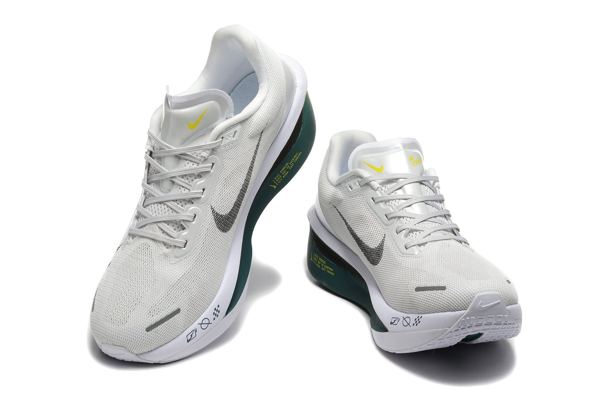 Off-white Nike Zoom Fly 6 shoes with dark green and yellow accents, viewed from the front