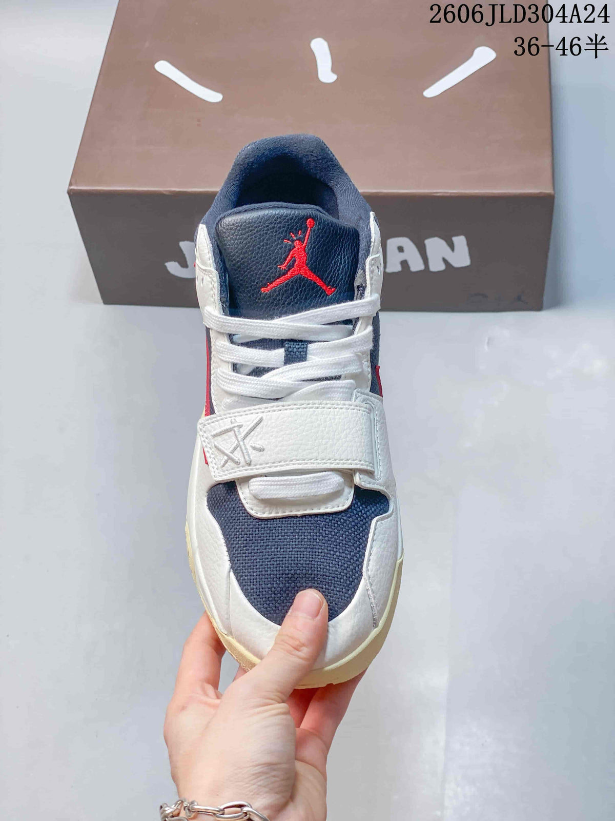 Front view highlighting the navy toe panel, laces, and strap