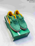 Pair of green and yellow PUMA Palermo sneakers displayed on a green shoebox.