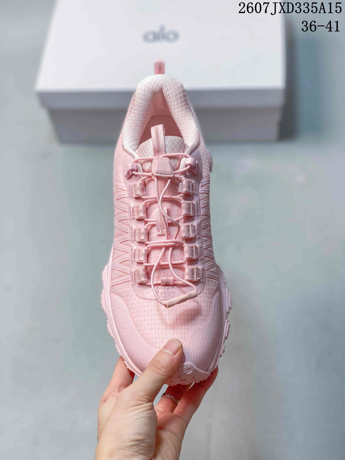 Top view of the pink sneaker showing the lace system, lace guides and textured toe area.