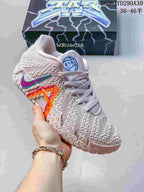 Pale pink and white Nike Ja 3 basketball shoe with teal and magenta accents