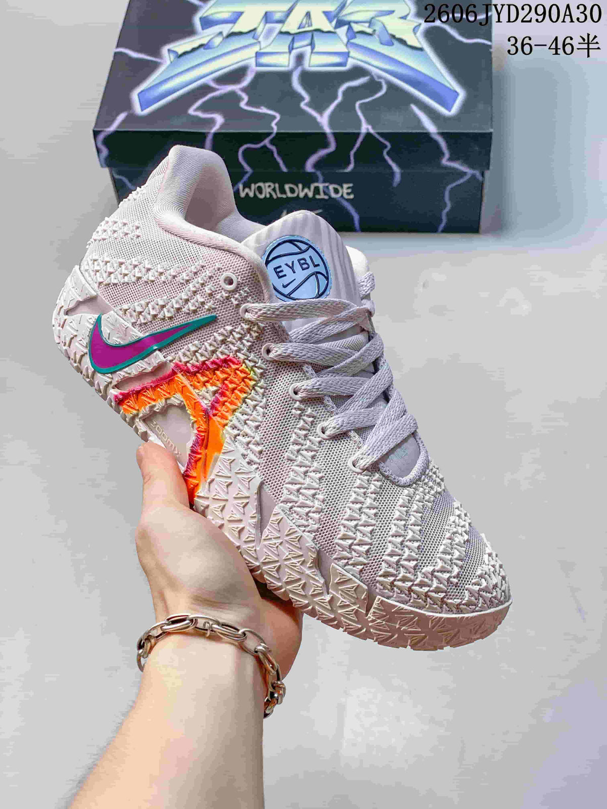 Pale pink and white Nike Ja 3 basketball shoe with teal and magenta accents