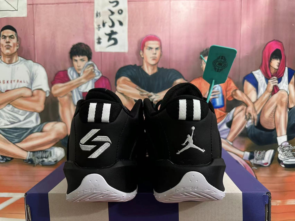 Rear view of black Jordan basketball shoes with white heel details and Jumpman embroidery