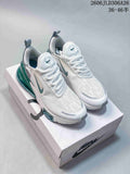 Pair of white and teal Nike Air Max 270 Premium sneakers displayed on a shoebox