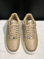 Front top view of the pair showing the lace arrangement, metal lace hardware and perforated toe panels.
