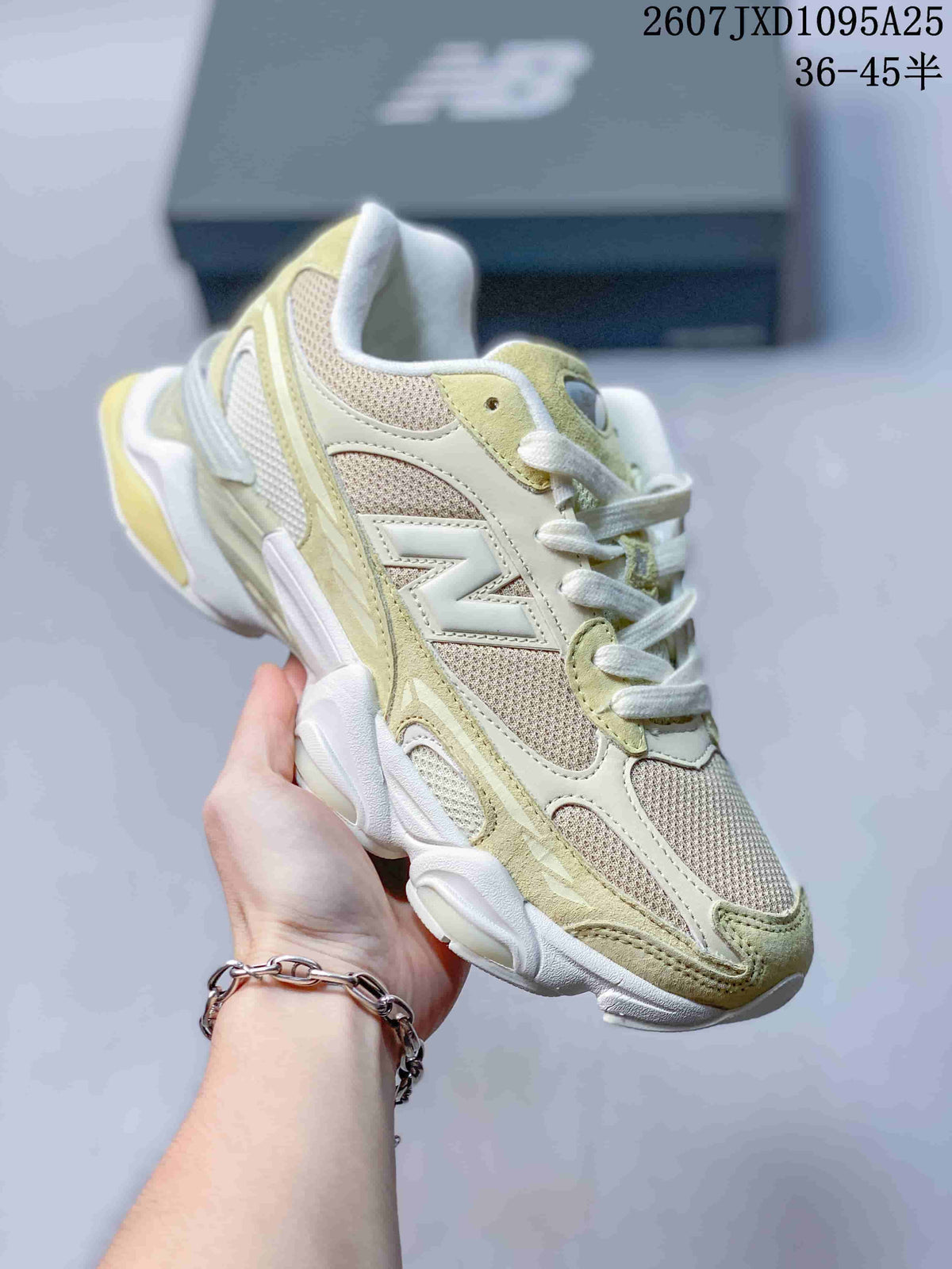Angled side view of a New Balance 9060R sneaker showing the N logo, mesh panels and pale green overlays.