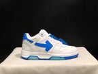 Side profile of a single white and blue low-top sneaker with the contrasting arrow motif.
