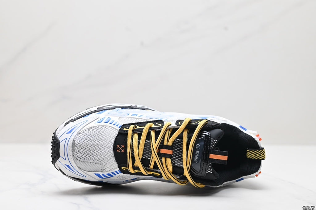 Top-down view showing the mesh toe box, black tongue, yellow laces, and pull tabs.