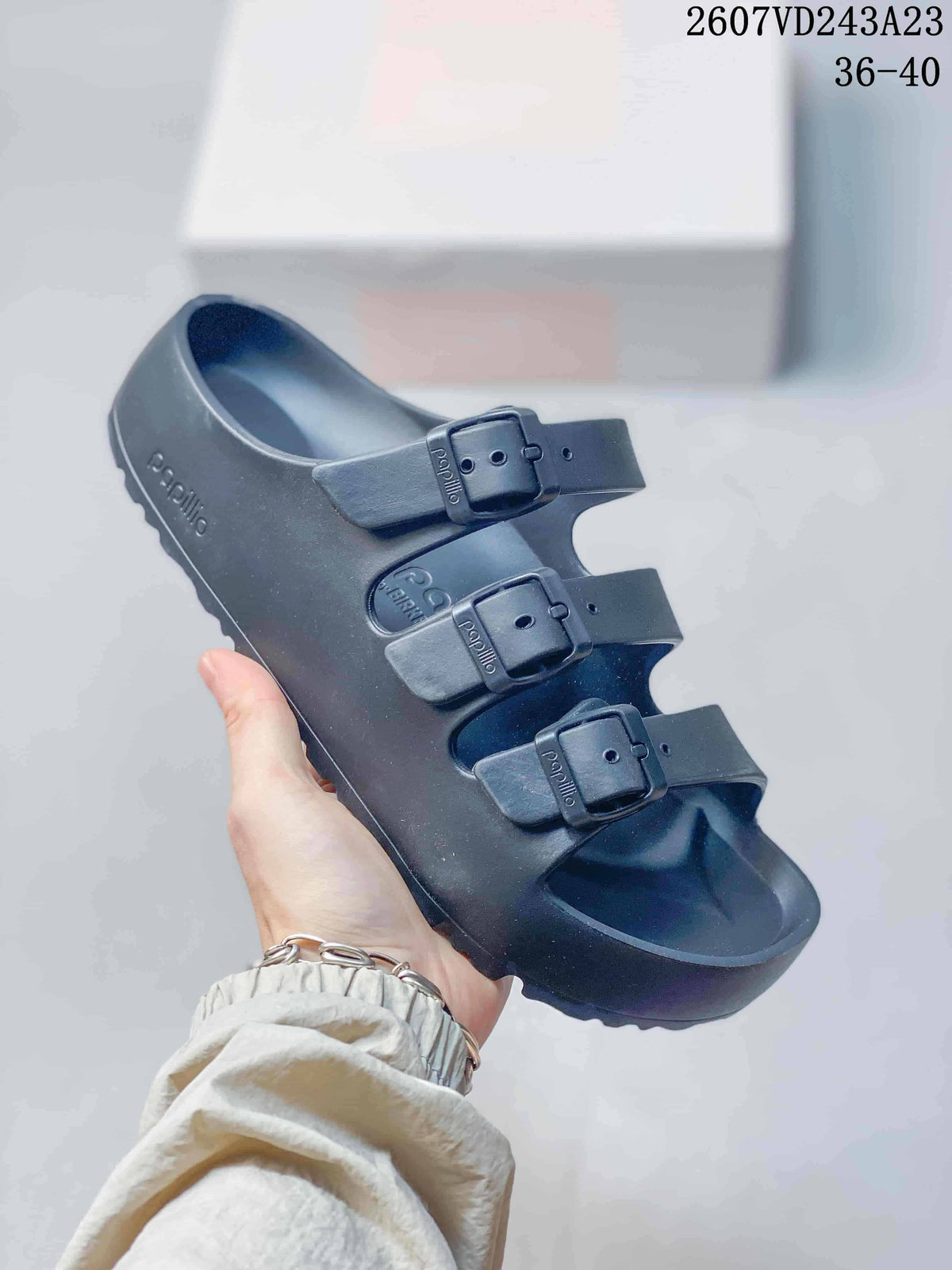 Black Papillio three-strap sandal with three adjustable buckles.