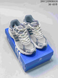 Pair of cream and gray adidas Response CL sneakers displayed on a blue adidas shoe box.