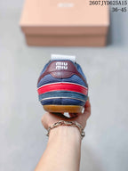Rear view of the navy sneakers showing the red heel accent, burgundy heel panel, and Miu Miu branding; image text lists sizes 36–45.