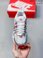 Top view showing the white laces, mesh-textured tongue and silver toe overlays.