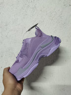 Purple Balenciaga chunky sneaker shown from the lateral side, highlighting layered panels, mesh sections, gray accents, and the sculpted sole.