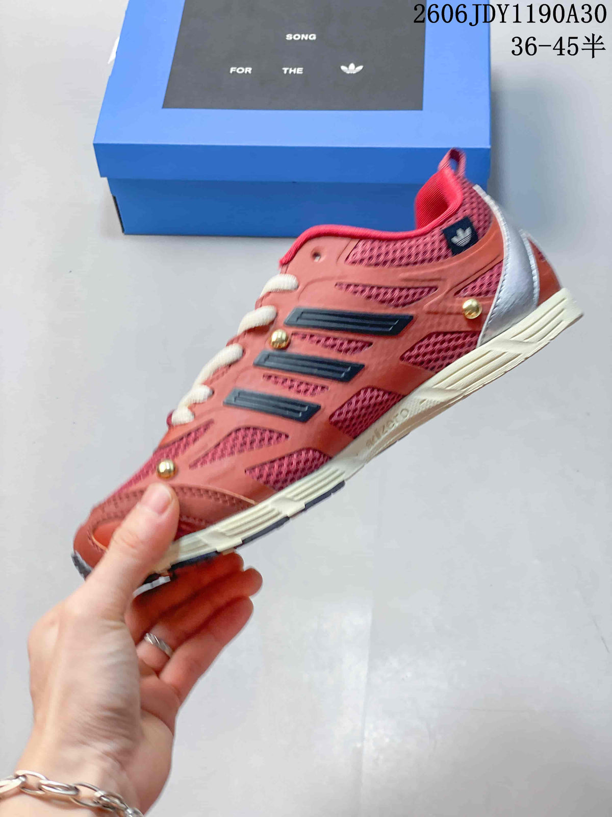 Side view of the sneaker with layered overlays and contrasting stripes.