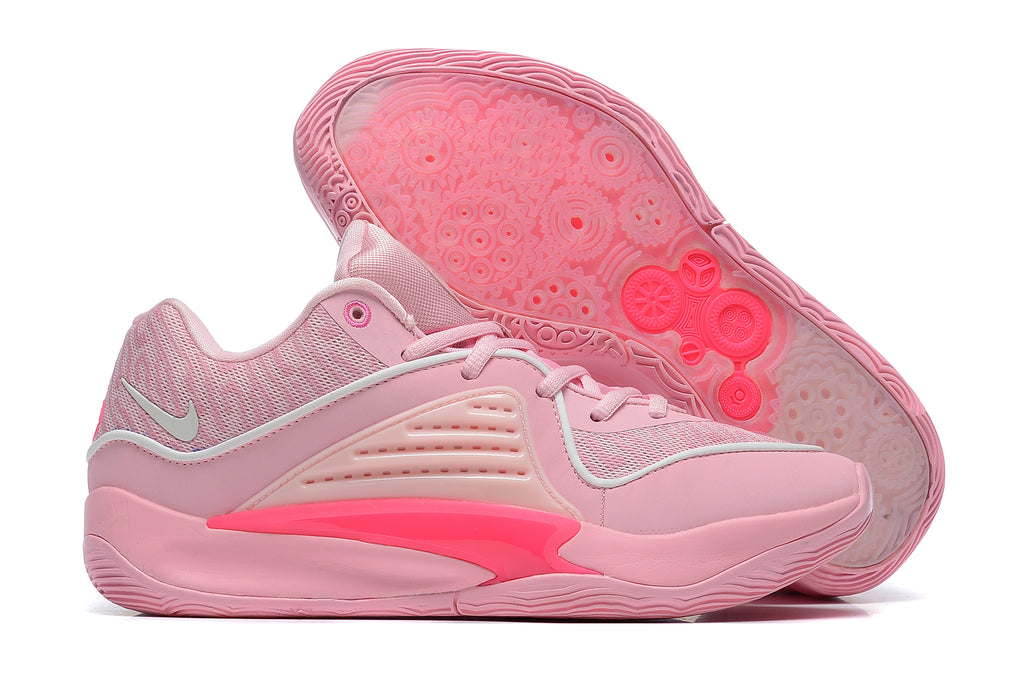 Pink Nike KD 16 shoes shown from the side and underneath, with a patterned outsole.